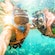 Two people wearing snorkeling gear underwater